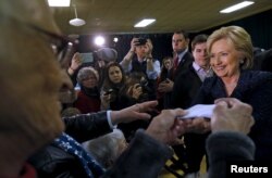 Democratic presidential candidate Hillary Clinton greets attendees at a campaign event in Vinton, Iowa, Jan. 21, 2016.