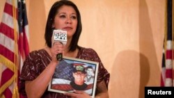 FILE - A woman speaks about her Vietnam veteran father at a community forum over recent allegations of gross mismanagement and neglect of veterans health care in Phoenix, Arizona May 9, 2014.