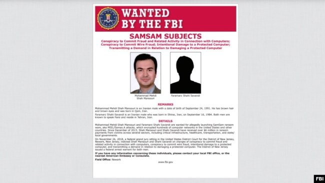FILE - Mohammad Mehdi Shah Mansouri and Faramarz Shahi Savandi are wanted for allegedly launching SamSam ransomware, which encrypted hundreds of computer networks in the United States and other countries.