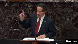 U.S. House lead impeachment manager Rep. Jamie Raskin (D-MD) points up at a video that he had just shown of Trump supporters storming the U.S. Capitol building while Raskin addresses the U.S. Senate as it begins the second impeachment trial of former U.S. President Donald Trump, 