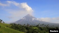 Volcanic ash spews out of a crater of Mount Mayon volcano during an eruption in Camalig, Albay province, south of Manila, Philippines, Jan. 29, 2018.