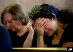 Coptic Christians grieve during prayers for the departed, remembering the victims of EgyptAir flight 804 at Al-Boutrossiya Church, at the main Coptic Cathedral complex, in Cairo, Egypt, May 22, 2016.