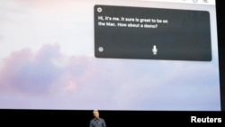 FILE - Craig Federighi, Senior Vice President of Software Engineering for Apple Inc, discusses the Siri desktop assistant for Mac OS Sierra at the company's World Wide Developers Conference in San Francisco, California, U.S.