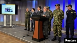 Colombian defense minister Guillermo Botero speaks during a news conference giving details of the investigation into the car bomb attack, in Bogota, Colombia, Jan. 18, 2019, in this hnadout photo, courtesy of Colombian Presidency.