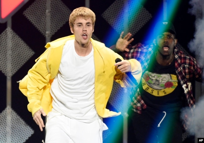 FILE - Justin Bieber performs at the 2016 Jingle Ball at Staples Center on Dec. 2, 2016, in Los Angeles.