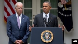 President Barack Obama, accompanied by Vice President Joe Biden, speaks in the Rose Garden of the White House, June 25, 2015, in Washington, after the U.S. Supreme Court upheld the subsidies for customers in states that do not operate their own exchanges 