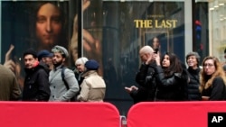 Visitors to Christie's wait outside in a line to view Leonardo da Vinci's "Salvator Mundi," Nov. 14, 2017, in New York. 