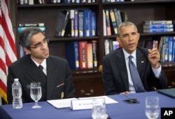 President Barack Obama and U.S. Surgeon General Dr. Vivek Murthy discuss the impact of climate change on public health at Howard University in Washington, April 7, 2015.