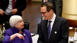 Janet Yellen, president of the Federal Reserve Board, and U.S. Treasury Secretary Steven Mnuchin talk to each other during the G20 finance ministers meeting in Baden-Baden, Germany, March 17, 2017.