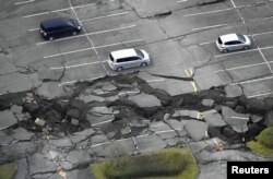 Cracks caused by an earthquake is seen at a parking lot in Minamiaso town, Kumamoto prefecture, southern Japan, in this photo taken by Kyodo, April 16, 2016.