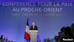 French Minister of Foreign Affairs Jean-Marc Ayrault addresses delegates at the opening of the Mideast peace conference in Paris, Jan. 15, 2017. Around 70 countries and international organizations are making a new push for a two-state solution in the Middle East at the conference in Paris. 