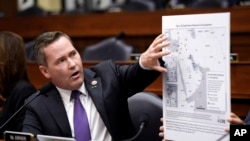 Rep. Michael Waltz, R-Fla., displays a map during a House Armed Services Committee hearing on the conclusion of military operations in Afghanistan, Sept. 29, 2021, on Capitol Hill in Washington.