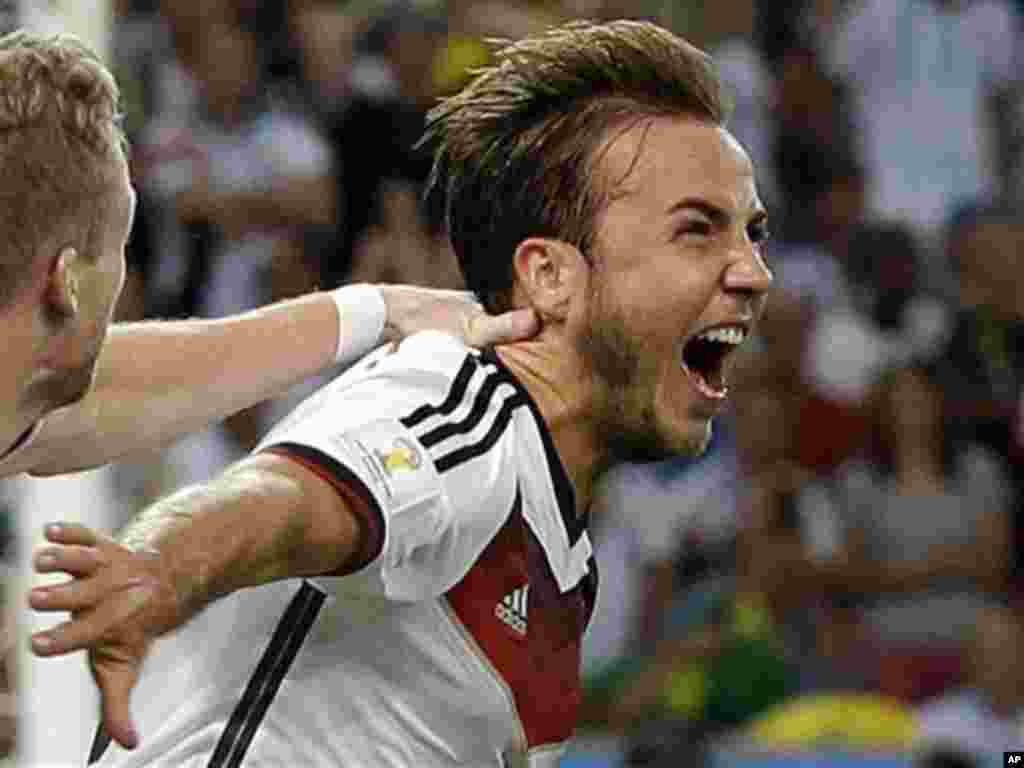 Germany's Mario Goetze celebrates after scoring the opening goal during the World Cup final soccer match between Germany and Argentina at the Maracana Stadium in Rio de Janeiro, Brazil, Sunday, July 13, 2014. (AP Photo/Victor R. Caivano)