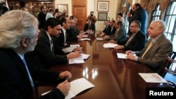 Cyprus' President Nicos Anastasiades (C) chairs a meeting with party leaders and governor of the Central Bank of Cyprus at the presidential palace in Nicosia March 20, 2013.