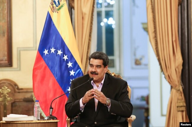 Venezuela's President Nicolas Maduro speaks during a meeting with members of the Venezuelan diplomatic corp after their arrival from the United States, at the Miraflores Palace in Caracas, Jan. 28, 2019.