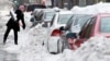 Slow Return to Normal Routines for Cities Hit by Snowstorm