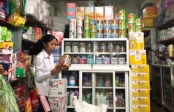 Various brands of baby formulas sold in Svay Rieng province in eastern Cambodia. At 9 P.M.​ a father came to buy a 0-6 month baby formula at the local store for the newborn baby, on October 11, 2019. (Khan Sokummono/VOA Khmer)