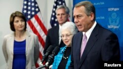 U.S. House Speaker John Boehner (R-OH) (R) shouts, "This isn't some damn game" during a news conference with fellow House Republicans at the U.S. Capitol in Washington, Oct. 4, 2013. 