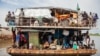 South Sudanese returnees arrive at the port in Juba, August 31, 2012. Tens of thousands remain stranded in Sudan and in camps near the border. (Reuters) 