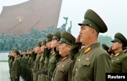 North Korean soldiers salute at Mansudae hill in Pyongyang, North Korea, in this photo taken by Kyodo, Sept. 9, 2017, on the 69th founding anniversary of the country.