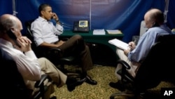 President Barack Obama is briefed on the situation in Libya during a secure conference call that included National Security Adviser Tom Donilon, right, and Chief of Staff Bill Daley, left.