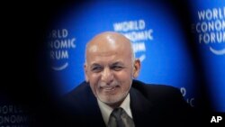 Afghanistan's President Ashraf Ghani smiles during a session at the annual meeting of the World Economic Forum in Davos, Switzerland, Thursday, Jan. 24, 2019. 