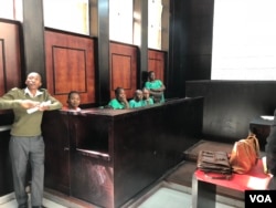 Some of the people arrested after last week’s opposition protest follow proceedings at Harare Magistrates’ Court where the Zimbabwe Lawyers for Human Rights applied for their bail. (C. Mavhunga/VOA)