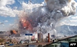 A massive explosion guts Mexico's biggest fireworks market in Tultepec, Dec. 20, 2016.