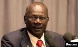 FILE - South Sudan's Information Minister Michael Makuei speaks to reporters in Ethiopia's capital, Addis Ababa, Jan. 5, 2014.