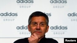 FILE - Herbert Hainer, chief executive officer of Adidas, the world's second largest sports apparel firm, pauses during the company's annual news conference in Herzogenaurach, March 7, 2013.