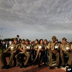 Members of the Cuban Armed Forces attend an event marking the 1953 assault on the Moncada military barracks in Ciego de Avila, Cuba July 26, 2011