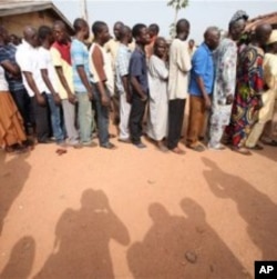 People wait to be registered at a polling station at Oyeleye in Ibadan, Nigeria.