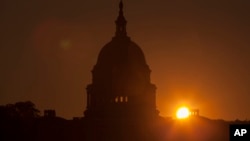 The sun rises over the Capitol in Washington, Sept. 24, 2013. (AP)
