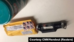 A package containing a "live explosive device" according to police, received at the Time Warner Center which houses the CNN New York bureau, in New York City, is shown in this handout picture provided Oct.24, 2018.