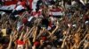 Egyptians listen to the speech of Egypt's President-elect Mohamed Morsi, in Tahrir Square in Cairo, Egypt, Friday, June 29, 2012.