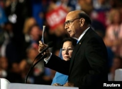 FILE - Khizr Khan, whose son Humayun was killed serving in the U.S. Army, challenges Republican presidential nominee Donald Trump to read his copy of the U.S. Constitution at the Democratic National Convention in Philadelphia, July 28, 2016.