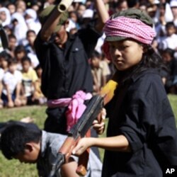 Cambodian students re-enact torture executed by the Khmer Rouge to mark the annual 'Day of Anger' at Choeung Ek, a former Khmer Rouge 'killing field' dotted with mass graves about nine miles (15 kilometers) south of Phnom Penh (File Photo)