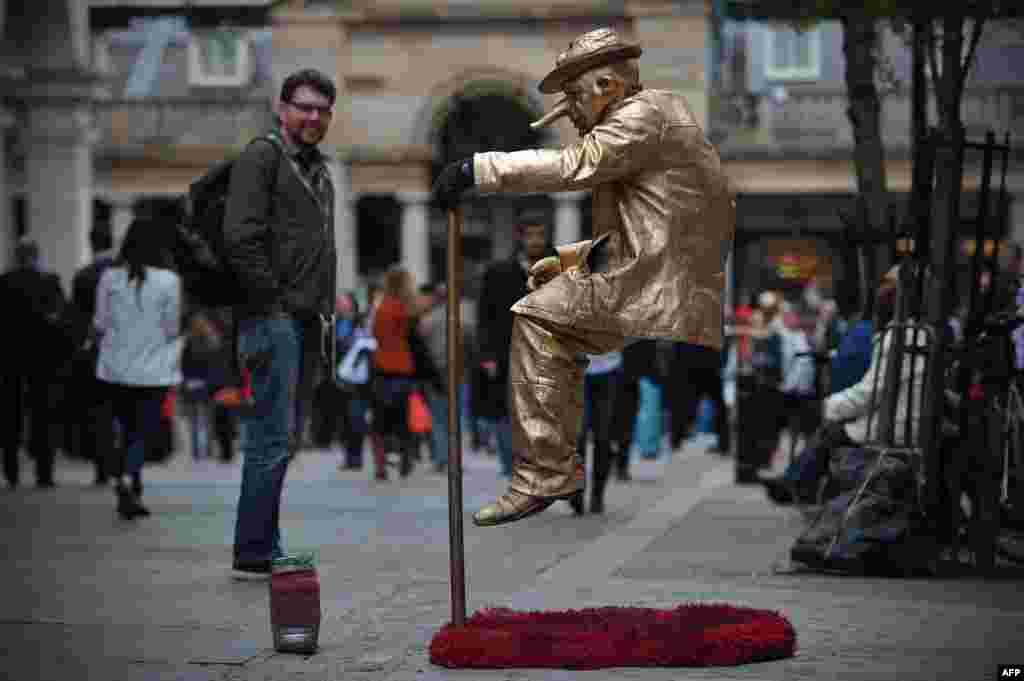 A street artist performs in Covent Garden in central London.