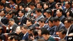 Chinese top leaders attends the third plenary session of the National People's Congress (NPC) at Great Hall of the People in Beijing, China, Monday, March 10, 2014. 