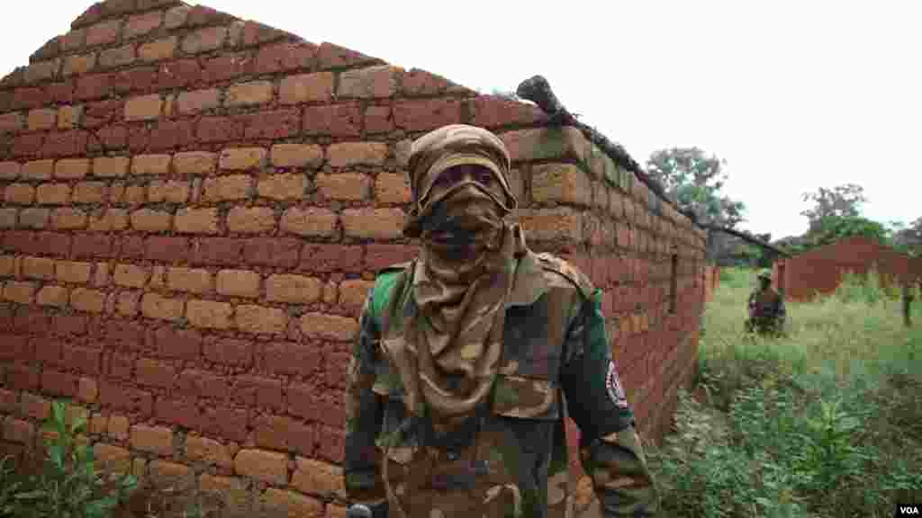 Regional peacekeepers at an abandoned village on the road south of Bossangoa, Nov. 13, 2013. (Hanna McNeish for VOA)