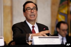 FILE - Treasury Secretary Steven Mnuchin speaks during a meeting at the Treasury Department in Washington, Oct. 16, 2018.