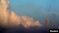 FILE - Vapor rises from Liddell Power Station near Muswellbrook, 170 km (106 miles) north of Sydney, Nov. 2, 2011.