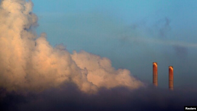 FILE - Vapor rises from Liddell Power Station near Muswellbrook, 170 km (106 miles) north of Sydney, Nov. 2, 2011.