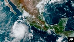 This satellite image provided by the National Oceanic and Atmospheric Administration shows a Tropical Storm Pamela in the Pacific as it approaches Mexico, Oct. 11, 2021.