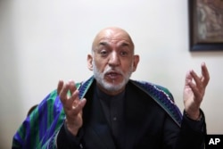 FILE - Former Afghan President Hamid Karzai speaks during an interview with the Associated Press in Kabul, Afghanistan, April 17, 2017.
