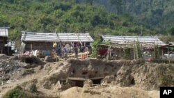 Bomb shelters built by Kachin refugees, at the Je Yang IDP camp, near Laiza, northeastern Burma, Friday, Jan. 4, 2013. 