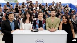 From left, jury members Panos H. Koutras, Nadine Labaki, Isabella Rossellini, Tahar Rahim and Haifaa Al-Mansour pose for photographers during a photo call for the jury of Un Certain Regard, at the 68th international film festival, Cannes, southern France, May 14, 2015. 