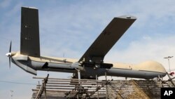 FILE - An Iranian Shahed-129 drone is displayed by armed forces in a rally commemorating the 37th anniversary of the Islamic Revolution in Tehran, Iran, Feb. 11, 2016. Shahed, which means "witness" in both Farsi and Arabic, is a name of a family of drones produced by Iran.