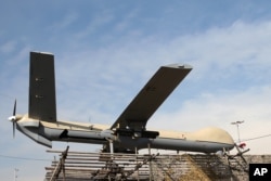 FILE - An Iranian Shahed-129 drone is displayed by armed forces in a rally commemorating the 37th anniversary of the Islamic Revolution in Tehran, Iran, Feb. 11, 2016. Shahed, which means "witness" in both Farsi and Arabic, is a name of a family of drones