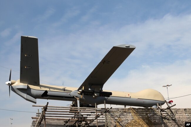 FILE - An Iranian Shahed-129 drone is displayed by armed forces in a rally commemorating the 37th anniversary of the Islamic Revolution in Tehran, Iran, Feb. 11, 2016. Shahed, which means "witness" in both Farsi and Arabic, is a name of a family of drones